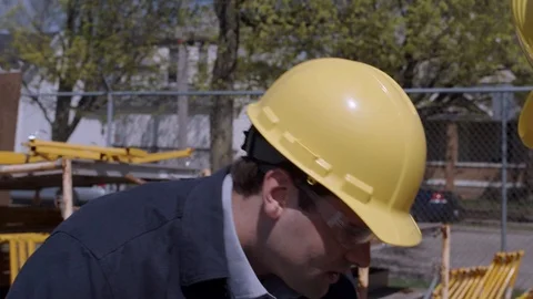 Supervisor speaking with employee about proper use of equipement Stock Footage 88961128