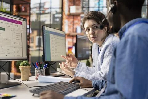 Supervisor, training and team, agents review tracking software on computer Stock Photos