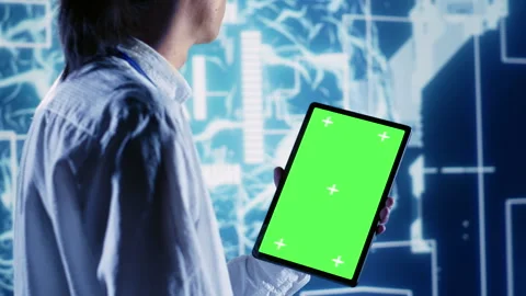 Supervisor uses chroma key tablet for AI Stock Footage 251591793