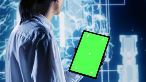 Supervisor uses chroma key tablet for AI Stock Photos