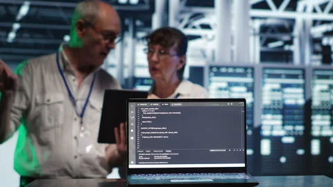 Supervisors running code in data center Stock Footage 247901507