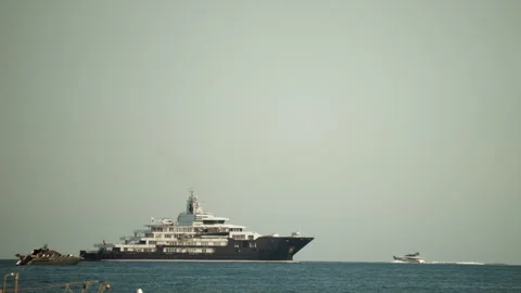 Superyacht ulysses navigating the ocean, an example of luxury travel, wealth, Vídeos de archivo 339805311
