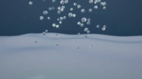 Supplement Granules Dissolving Through An Iridescent Film Water Surface Grey Vídeos de archivo 342408059