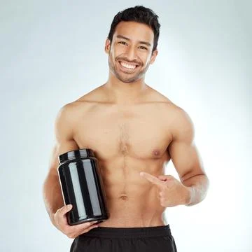 Supplementary muscular support makes a difference. a young man holding a tub of Stock Photos