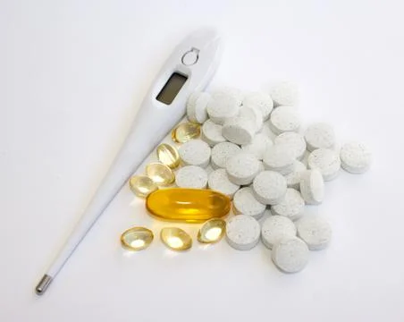 Supplements and electronic thermometer Stock Photos