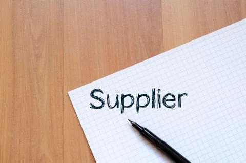 Supplier write on notebook Stock Photos