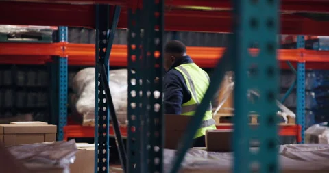 Supply chain, dancing and black man in warehouse, excited and parcel with Stock Footage 321119144