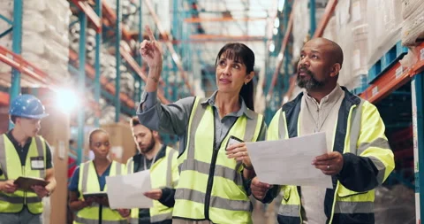 Supply chain, documents and people in warehouse, talking or logistics with Stock Footage 323998768
