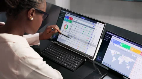 Supply Chain Manager Tracks Global Shipments In Real-time Stock Footage 345315574