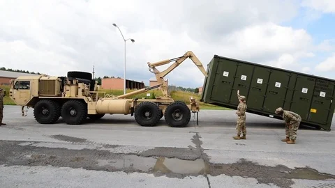 Supply containers being loaded and unloaded from truck during SSA - 2018 Stock Footage 106043912