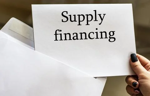 SUPPLY FINANCING words written in letter from envelope Stock Photos