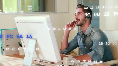 Support agent accepting call, speaking into mic at desk, hex code passing over Stock Footage 333774642
