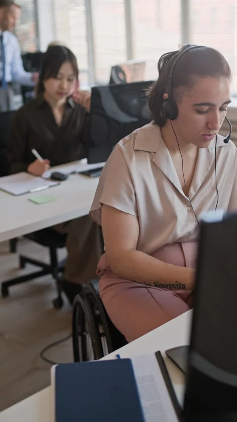 Support Agent with Disability Consulting Clients and Coworking with Colleagues Stock Footage 335760195