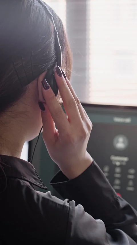 Support Agent in Headset Calling Customer on Computer in Call Center Stock Footage 335757742
