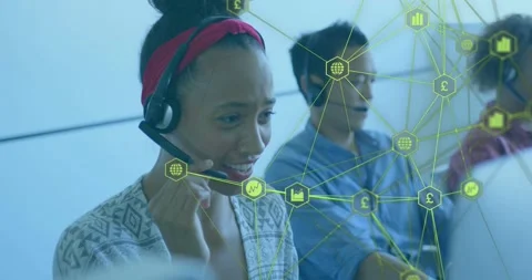 Support agent taking call, adjusting mic and reading screen as green network Stock Footage 334115580