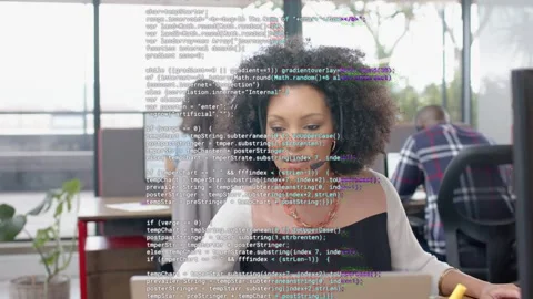 Support agent typing laptop on call, causing code static across screen then Stock Footage 333936807