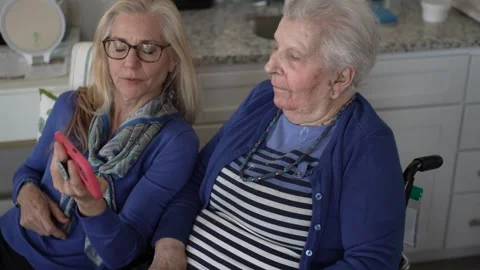 Support and Connection Between Mother and Daughter During a Cozy Visit at Home Stock Footage 308299634