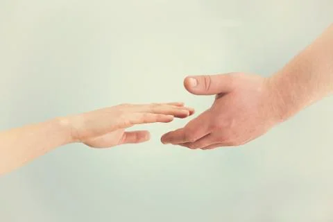 Support concept. Two hands reaching toward each other. Empathy, compassion, h Stock Photos