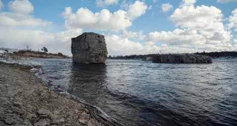 Support the destroyed bridge on river against blue sky Stock Photos