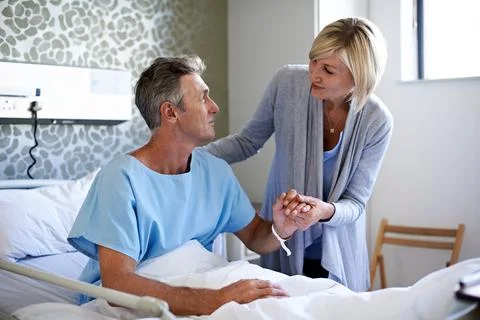Support, help and love with couple in hospital for medical recovery, connection Stock Photos