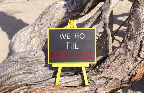 Support, help we go the extra mile symbol. Concept words We go the extra mi.. Stock Photos