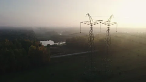 Support of a high-voltage power line in a wooded rural area. 스톡 동영상 163894206