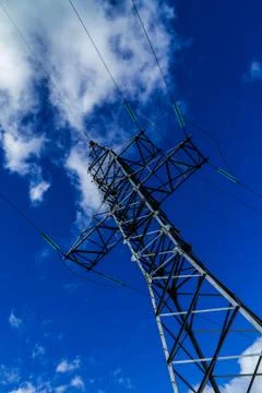 Support of high voltage power lines against the evening sky Stock Photos