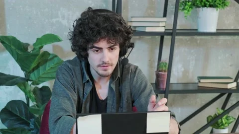 Support hotline worker with laptop and microphone at work. Stock Footage 155240048