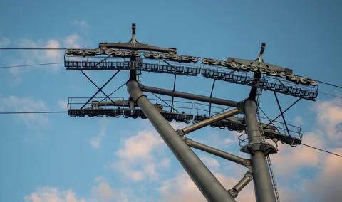 Support line of the cable car against the blue sky on a clear day Stock Photos