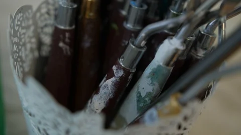 Support for painting tools. Closeup of artistic palette knives Stock Footage 116778036