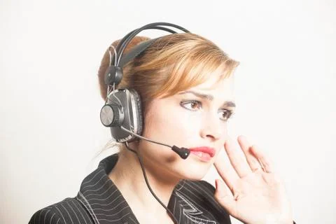 Support phone operator in headset at workplace 스톡 사진