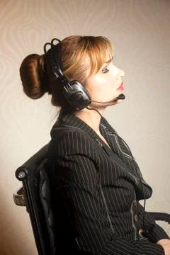 Support phone operator in headset at workplace Stock Photos