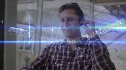 Support rep taking call, fixing mic, typing as binary streaks sweeping, Stock Footage 332642489
