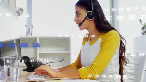 Support rep taking call, typing, talking, glancing notes, blue-white data 库存影片 333670936