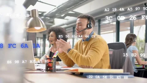 Support rep wearing headset taking call and guiding client on laptop, code Stock Footage 333949901