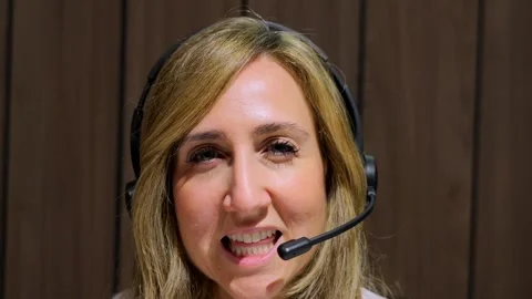 Support service worker talking to camera Stock Footage 262383320