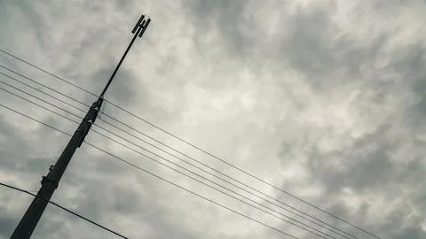 Support of a street lamp with a view of the cloudy sky Stock Photos