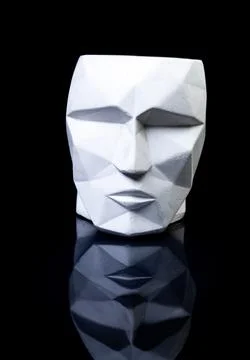 Support as a vase, focus in front. plaster vase in the shape of a face on a b Stock Photos