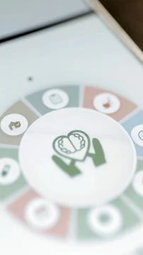 Support wheel around hands and brain emblem Stockfoto's