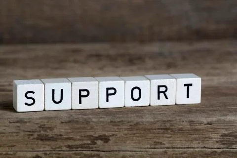 Support, written in cubes Stock Photos