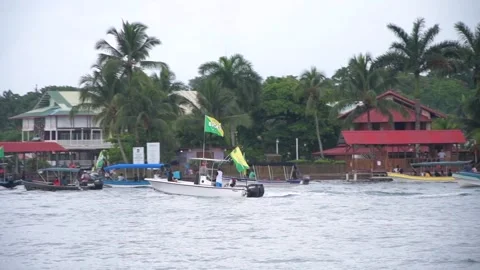 Supporters of Bocas del Toro Baseball Team Gather on Boats in Panama Stock Footage 336936343