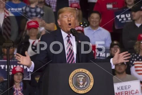 Supporters under US Flag at President Trump Re-election Rally - KEEP AMERICA Stock Photos
