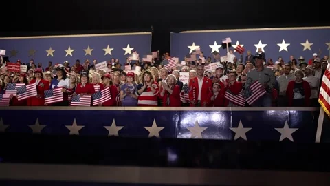Supporters wave American flags in the stands behind the stage, RNC Dallas 2026 Stock Footage 345271622