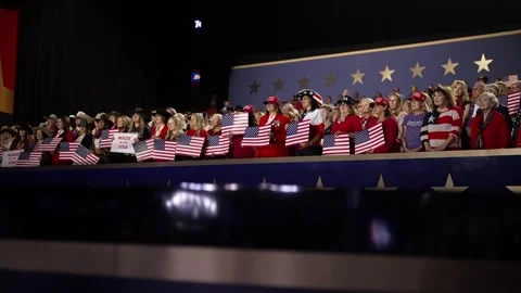 Supporters wave American flags in the stands behind the stage, RNC Dallas 2026 Stock Footage 345271791