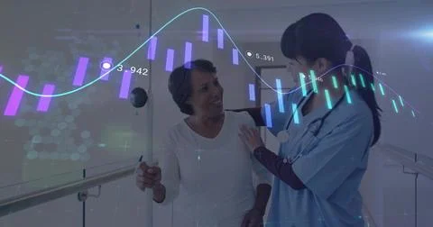 Supporting patient on parallel bars in corridor, nurse wearing scrubs Stock Photos