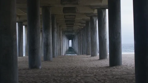 Supporting pillars under the pier at beach Stock Footage 108901058