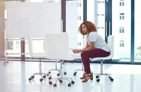 Supporting a solo brainstorm with smart tech. a thoughtful young businesswoman Stock Photos