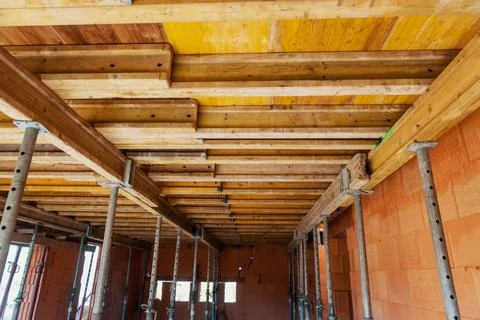 The supports of monolithic floor formwork at a construction site. Telescopic  Stock Photos