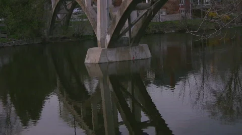 Supports to a walking bridge over river Stock Footage 401500