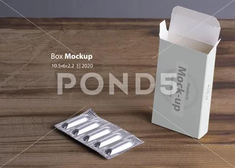 Suppositories loaf and empty box on wooden table background mock-up series PSD Template